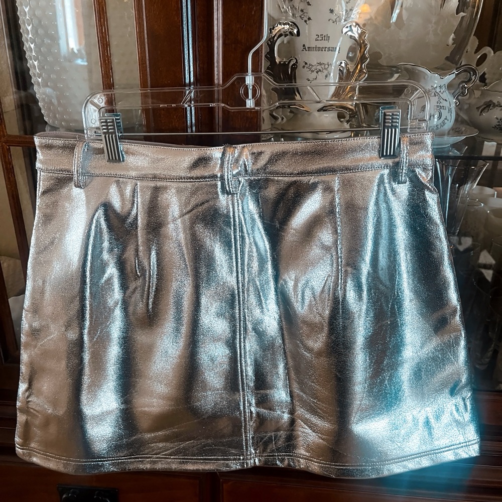 Metallic silver mini skirt. Worn twice. Size large. Fits like size 12.